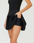 Black pleated golf skirt will keep you cool and chic